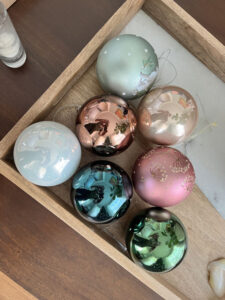 Multi-colored Christmas balls in a tray